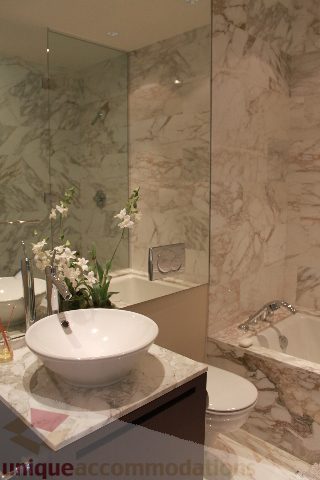 Bathroom with marble countertops and a modern sink. - 6002 - 1128 West Georgia, Vancouver Downtown