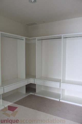 Bright walk-in closet with white shelving and sliding doors. - 6002 - 1128 West Georgia, Vancouver Downtown
