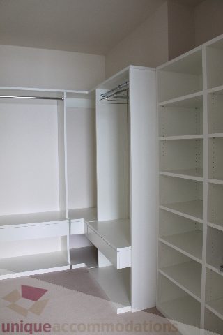 Bright walk-in closet with built-in shelves and a sliding door. - 6002 - 1128 West Georgia, Vancouver Downtown