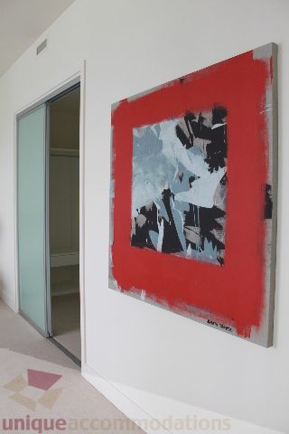 Bright living room with modern abstract art and frosted glass sliding door. - 6002 - 1128 West Georgia, Vancouver Downtown