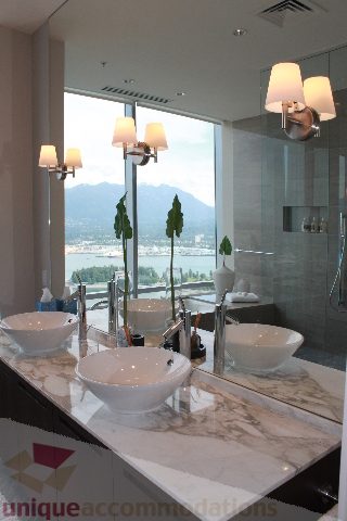 Bathroom with marble countertops, modern sink, and city view. - 6002 - 1128 West Georgia, Vancouver Downtown