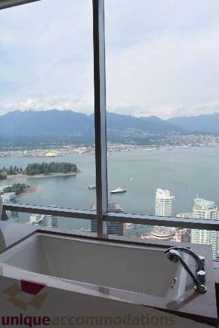 Bright kitchen with city view and modern sink, overlooking water and mountains. - 6002 - 1128 West Georgia, Vancouver Downtown