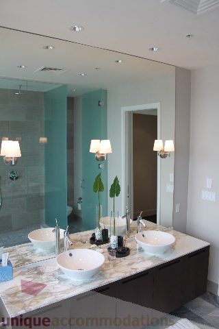 Bathroom with dual sinks, marble countertop, and modern lighting. - 6002 - 1128 West Georgia, Vancouver Downtown