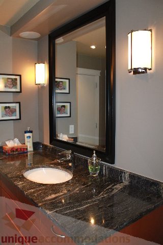 Bathroom with granite countertop and wall-mounted lights. - 2730 Ailsa Crescent, North Vancouver