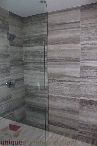 Shower with glass door and stone tiles. - 3304 - 1011 West Cordova, Vancouver Downtown