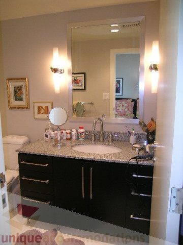 Furnished bathroom with granite countertops and black cabinets. - 707 - 638 Beach Crescent, Vancouver Downtown
