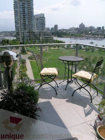 Balcony with outdoor seating and city view. - 707 - 638 Beach Crescent, Vancouver Downtown