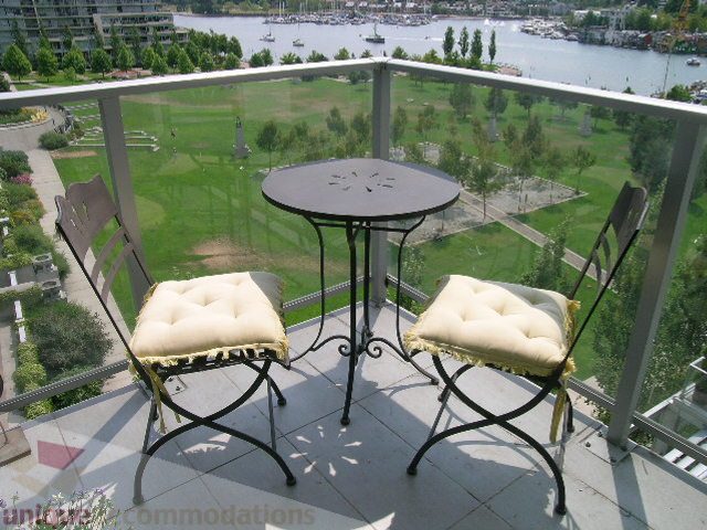 Balcony with outdoor seating and city view. - 707 - 638 Beach Crescent, Vancouver Downtown
