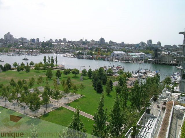 Furnished living room with city view and waterfront access. - 707 - 638 Beach Crescent, Vancouver Downtown