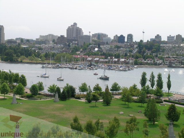 Furnished living room with a stunning city view and waterfront access. - 707 - 638 Beach Crescent, Vancouver Downtown