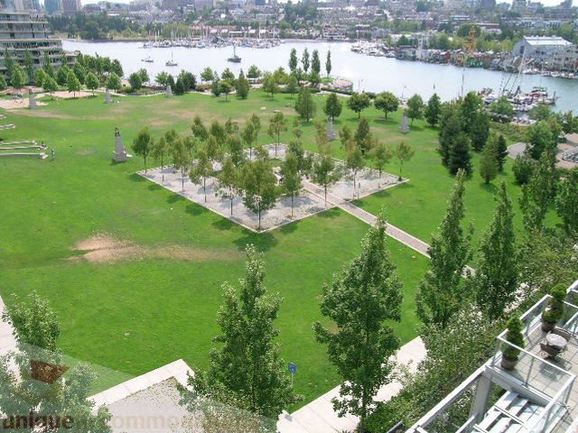 Furnished living room with city view and green park. - 707 - 638 Beach Crescent, Vancouver Downtown