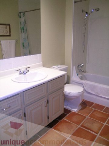 Bathroom with white vanity, tiled floor, and shower. - 405 - 4001 Mount Seymour Pkwy, North Vancouver