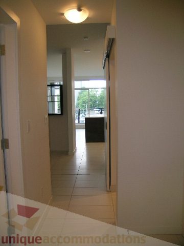 Bright hallway leading to a sunny balcony with city view. - 406 - 1252 Hornby Street, Vancouver Downtown