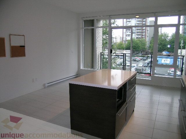 Bright kitchen with modern countertop and city view. - 406 - 1252 Hornby Street, Vancouver Downtown