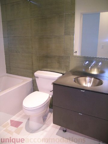 Modern bathroom with sleek countertop and contemporary sink. - 406 - 1252 Hornby Street, Vancouver Downtown