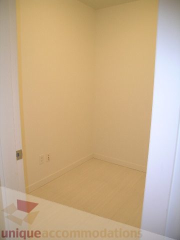 Bright bedroom with hardwood floors and white walls. - 406 - 1252 Hornby Street, Vancouver Downtown
