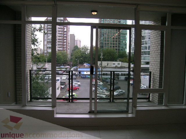 Furnished living room with city view and large windows. - 406 - 1252 Hornby Street, Vancouver Downtown