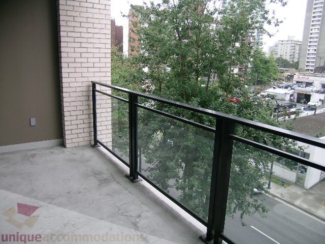 Furnished balcony with glass railing and city view. - 406 - 1252 Hornby Street, Vancouver Downtown