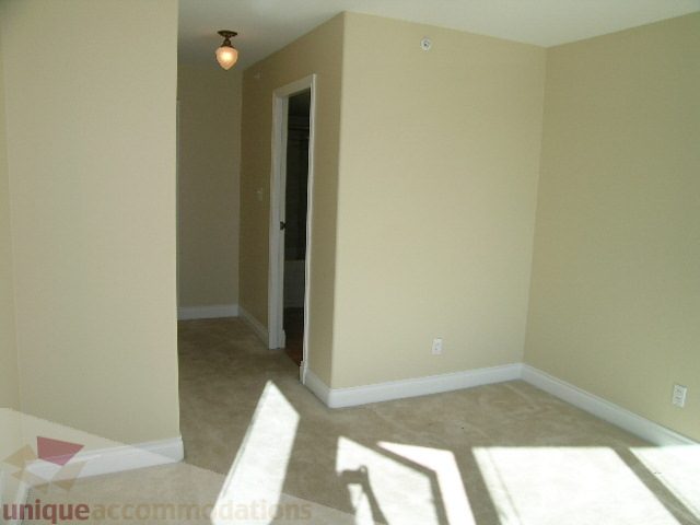 Bright living room with carpeted floor and beige walls. - 1602 - 560 Cardero, Vancouver Downtown