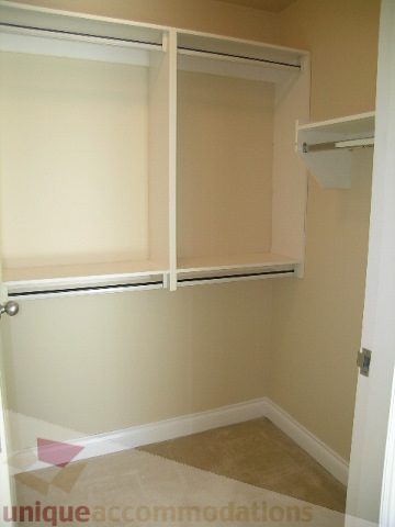 Spacious walk-in closet with sliding doors and built-in shelves. - 1602 - 560 Cardero, Vancouver Downtown