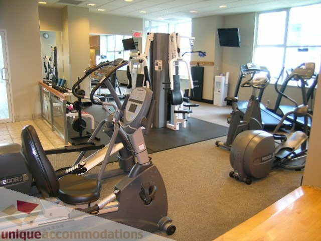 Bright gym with cardio machines and large windows, hardwood floors. - 1602 - 560 Cardero, Vancouver Downtown