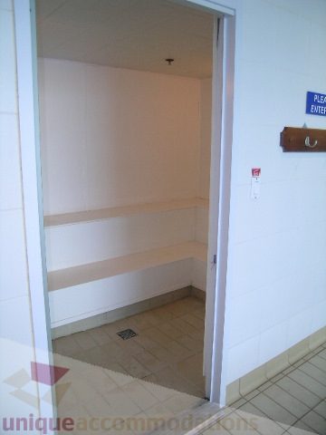 Bathroom with tiled walls and floor, small window. - 1602 - 560 Cardero, Vancouver Downtown