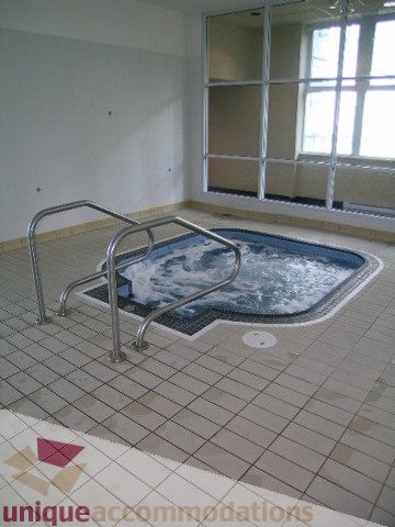 Spacious indoor hot tub with tiled floor and large window view. - 1602 - 560 Cardero, Vancouver Downtown
