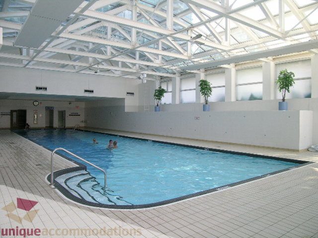 Spacious living room with large windows and modern decor. - 1602 - 560 Cardero, Vancouver Downtown