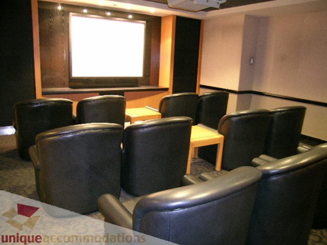 Bright home theater with plush leather seating and a large screen. - 1602 - 560 Cardero, Vancouver Downtown