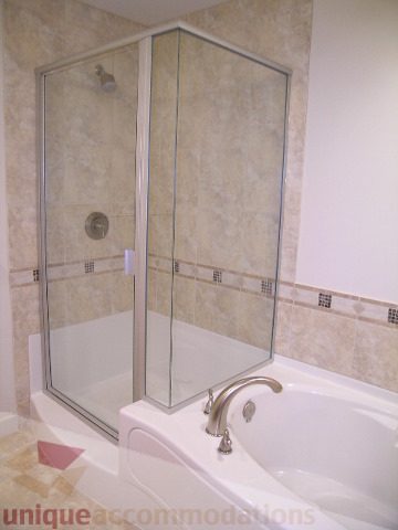 Spacious bathroom with a walk-in shower and a modern bathtub. - 8601 Seascape Place, West Vancouver