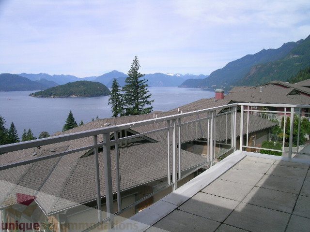 Spacious balcony with stunning ocean and mountain views, perfect for relaxing. - 8601 Seascape Place, West Vancouver