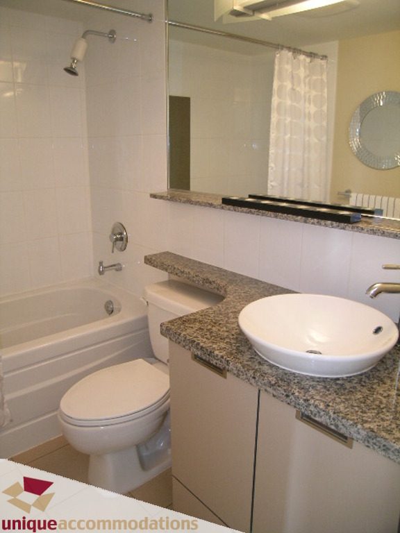 Bright bathroom with granite countertops and a modern sink. - 316 - 1082 Seymour, Vancouver Downtown