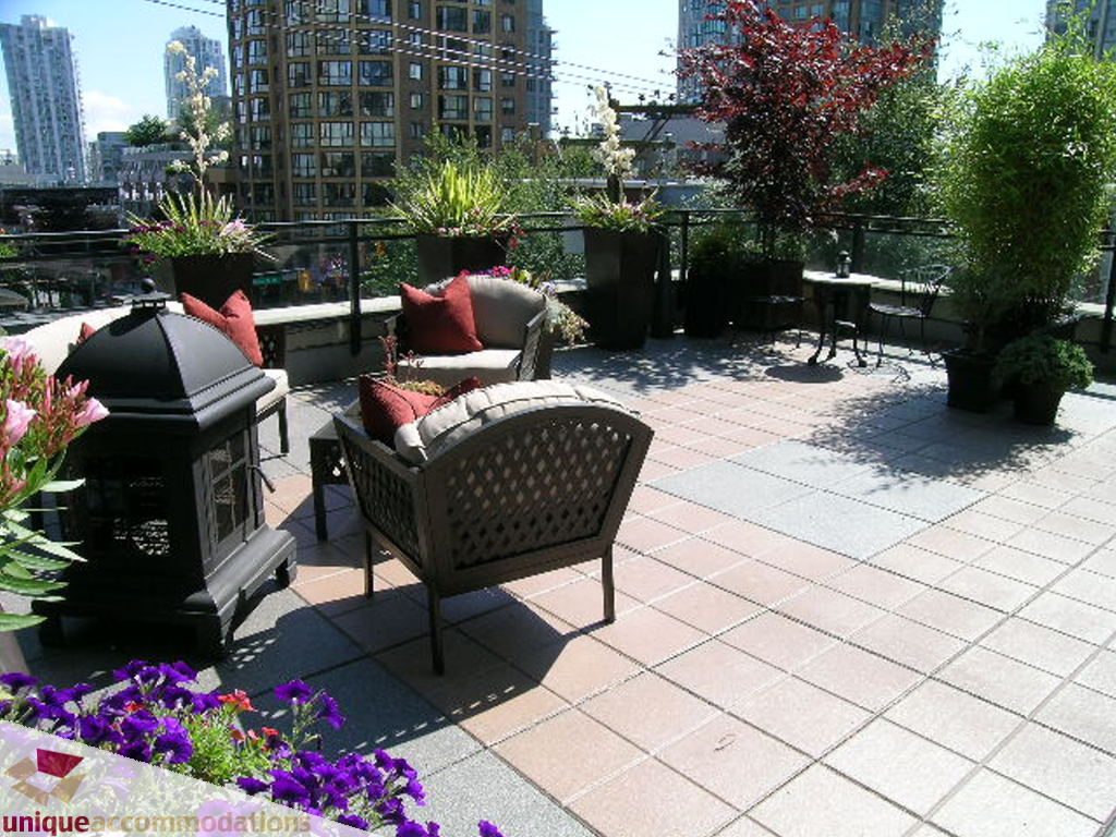 Furnished patio with outdoor seating, plants, and city view. - 316 - 1082 Seymour, Vancouver Downtown