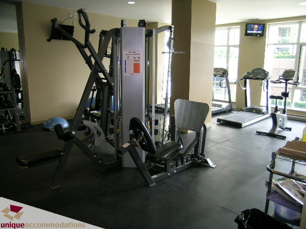 Bright gym with exercise equipment and large windows. - 316 - 1082 Seymour, Vancouver Downtown