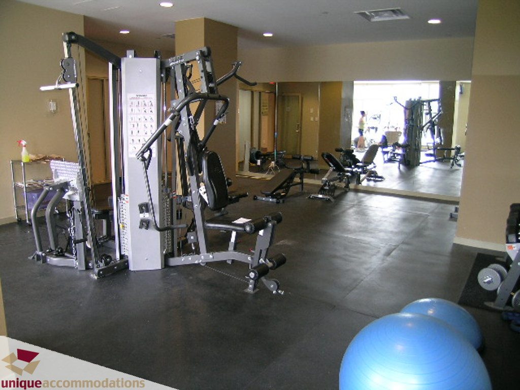 Bright gym with exercise equipment and blue stability balls. - 316 - 1082 Seymour, Vancouver Downtown