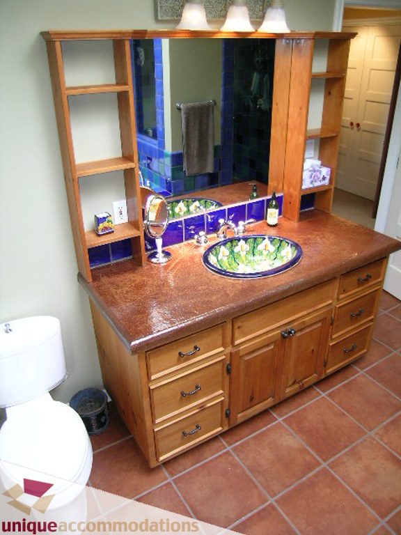 Bathroom with wooden vanity, tiled countertop, and mirror. - 1385 East 15th Street, North Vancouver