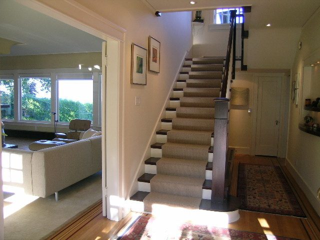 Staircase leading to upper floor with carpeted steps and wooden handrail. - 4663 Bellevue Drive, Vancouver West Side