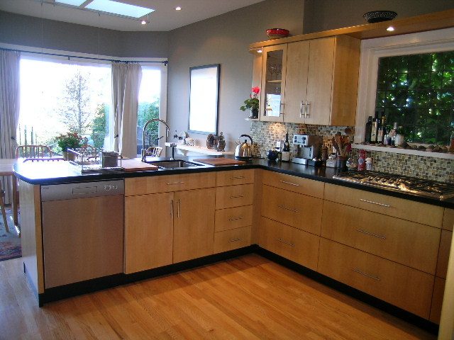 Bright kitchen with light wood cabinets, granite countertops, and hardwood floors. - 4663 Bellevue Drive, Vancouver West Side