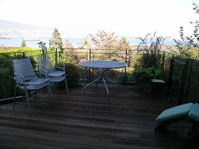 Furnished patio with outdoor table and chairs, overlooking a scenic view. - 4663 Bellevue Drive, Vancouver West Side