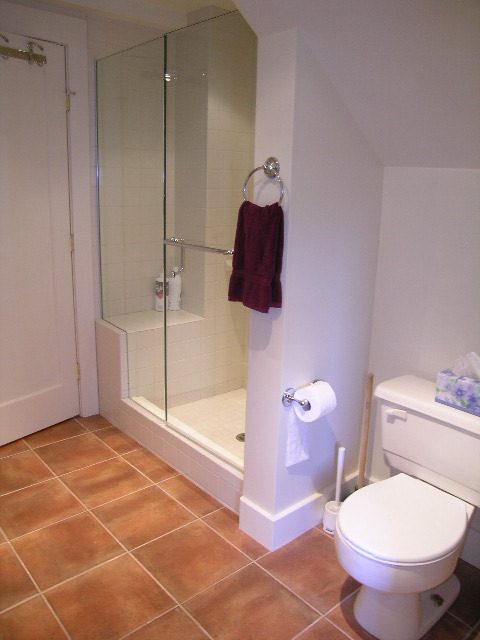 Bathroom with tiled floor, glass shower, and toilet. - 4663 Bellevue Drive, Vancouver West Side