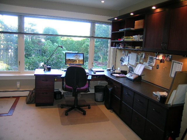 Bright home office with large windows, desk, and computer, surrounded by greenery. - 4663 Bellevue Drive, Vancouver West Side