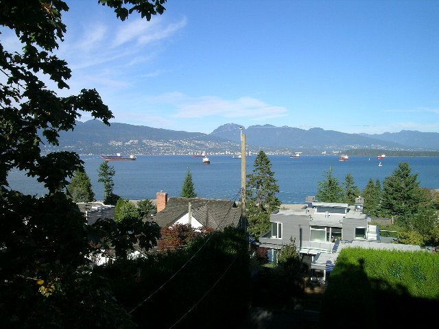 Furnished living room with a stunning city view and waterfront access. - 4663 Bellevue Drive, Vancouver West Side