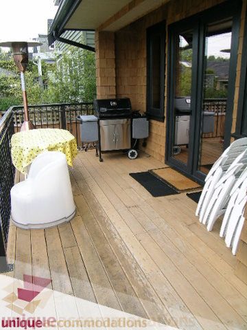 Furnished patio with outdoor grill and wooden deck. - 3030 West 15th Avenue, Vancouver West Side