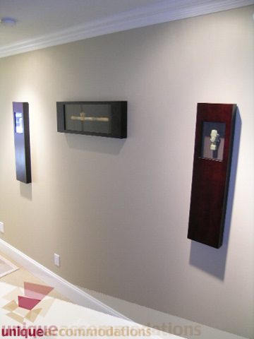 Bright living room with modern decor and wall-mounted shelves. - 3030 West 15th Avenue, Vancouver West Side