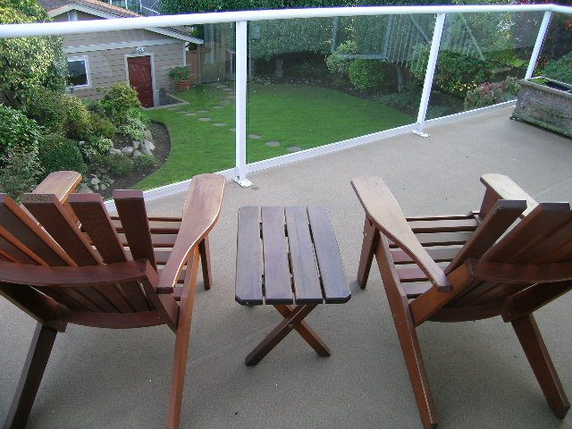 Furniture set on patio with grass and house in background. - 875 Whitchurch Street, North Vancouver
