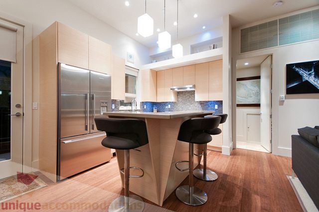Modern kitchen with sleek cabinetry, stainless steel appliances, and hardwood floors. - 1381 Bute Street, Vancouver Downtown
