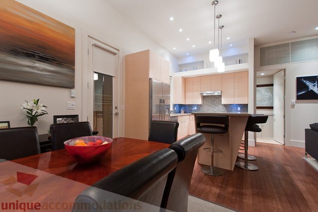 Bright kitchen with modern appliances, hardwood floors, and a city view. - 1381 Bute Street, Vancouver Downtown