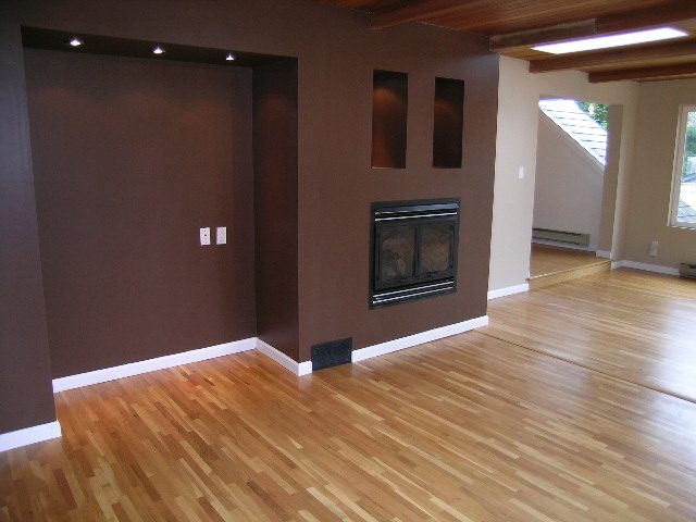 Spacious living room with hardwood floors and a modern fireplace. - 43 Glenmore Drive, West Vancouver