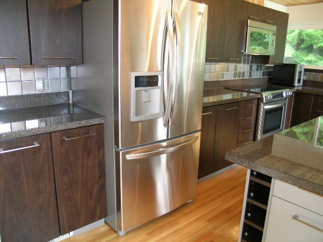 Modern kitchen with stainless steel appliances, granite countertops, and hardwood floors. - 43 Glenmore Drive, West Vancouver