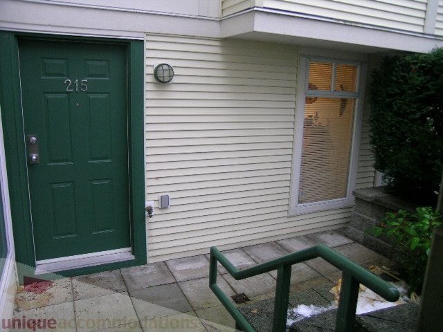 Cozy 2-bedroom + den condo with a green door and a small balcony. - 215 - 3727 West 10th Avenue, Vancouver West Side